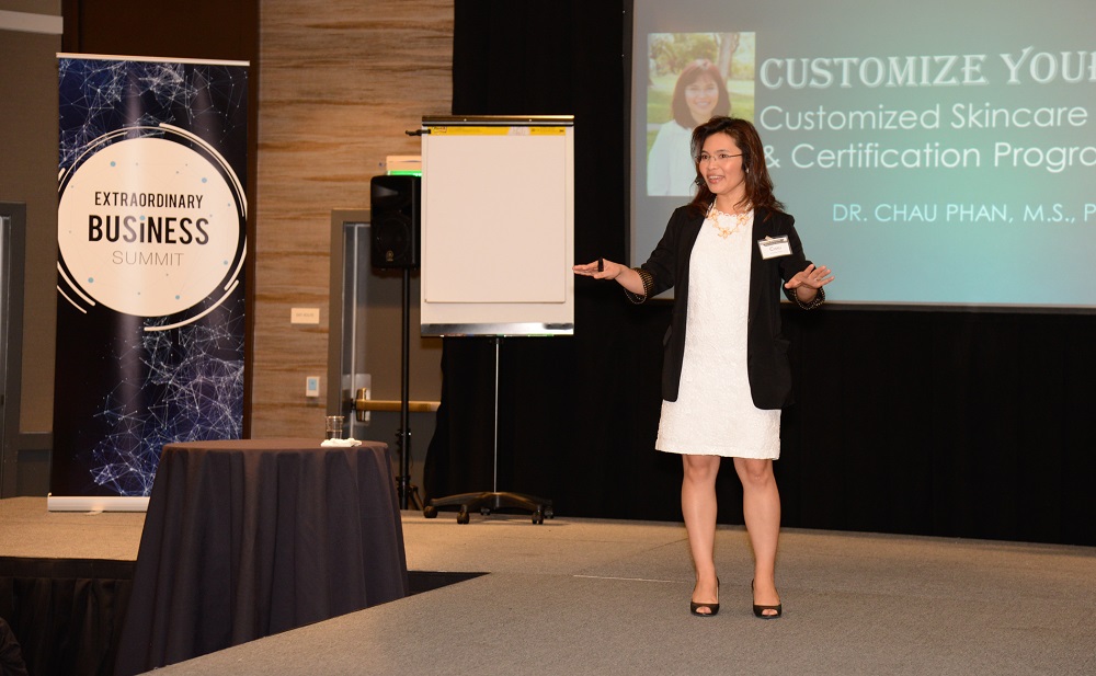 Dr. Chau Phan speaking at Extraordinary Business Summit